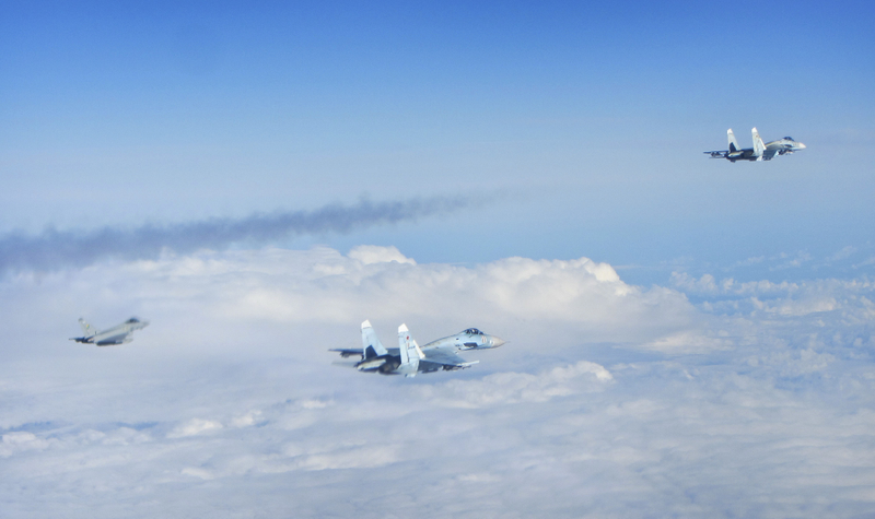 Illustration for article titled Photos of NATO fighters intercepting fully armed Russian jets